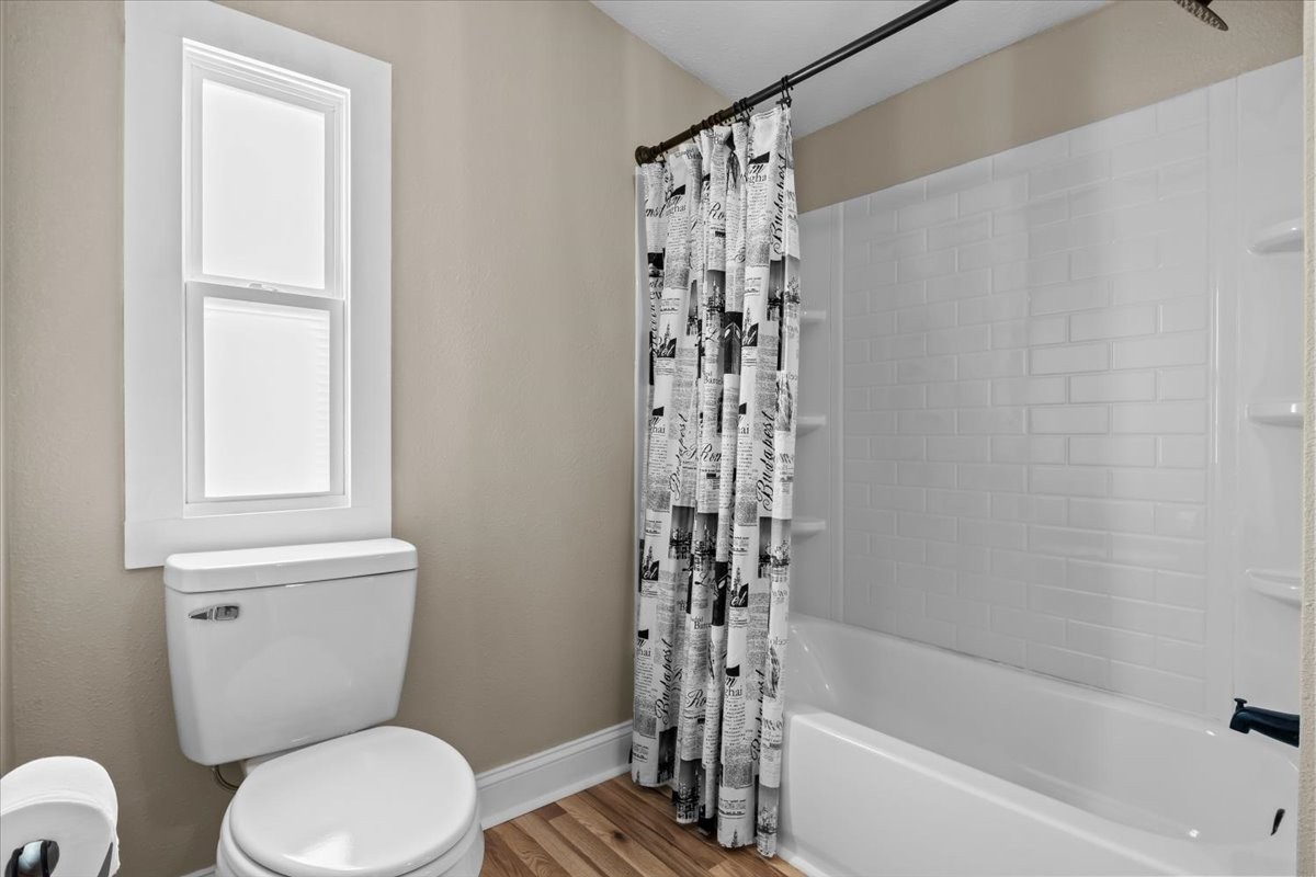 1112 Garners Creek Road Dickson, TN 37055 - Photo 29 of 57 a white toilet sitting next to a bath tub