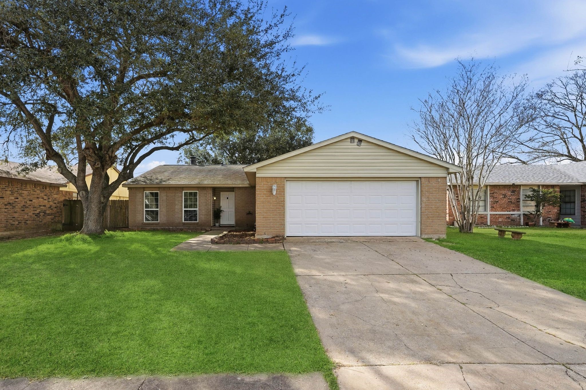 Pull on up to your charming one story brick home with a two car garage and double driveway. *grass is artificially enhanced