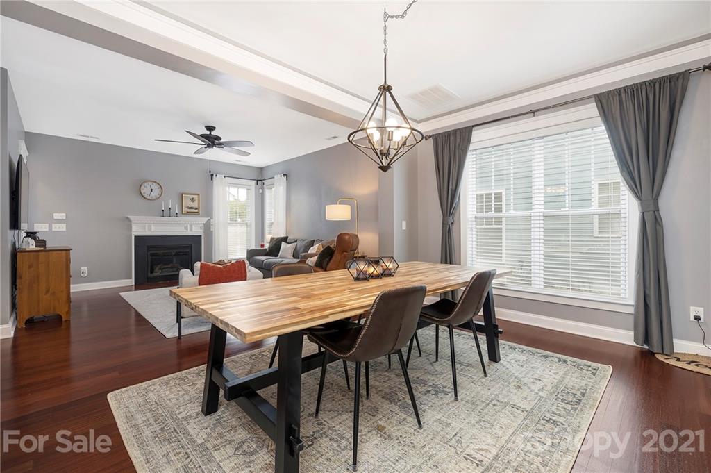 13524 Stumptown Road Huntersville, NC 28078 - Photo 5 of 26 a view of a dining room with furniture window and wooden floor