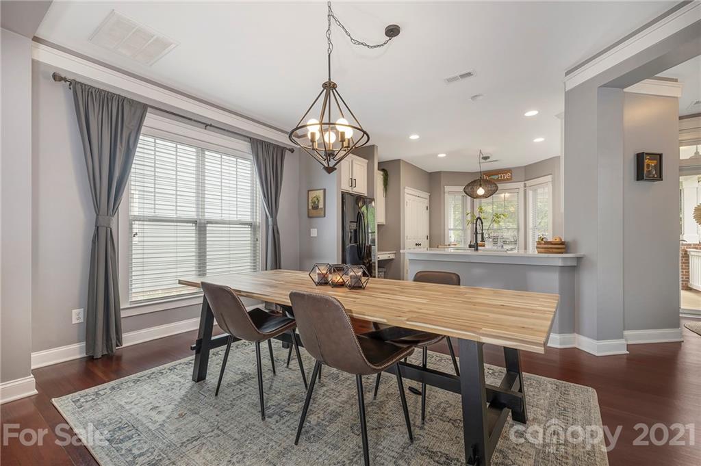 13524 Stumptown Road Huntersville, NC 28078 - Photo 6 of 26 a view of a dining room with furniture window and wooden floor