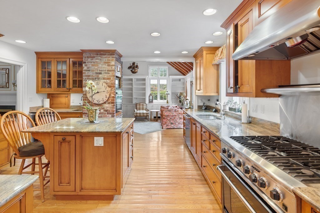32 Hidden Road Andover, MA 01810 - Photo 12 of 34 a kitchen with stainless steel appliances granite countertop a stove and a sink