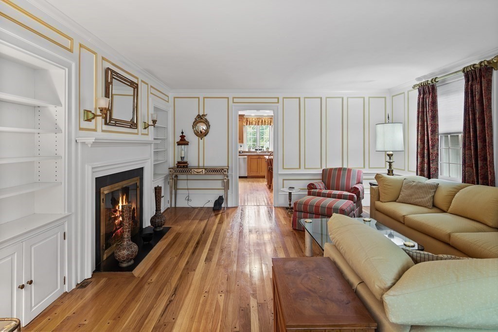 32 Hidden Road Andover, MA 01810 - Photo 20 of 34 a living room with furniture and a fireplace