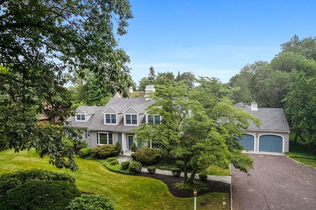 32 Hidden Road Andover, MA 01810 - Photo 2 of 34 a front view of a house with a garden