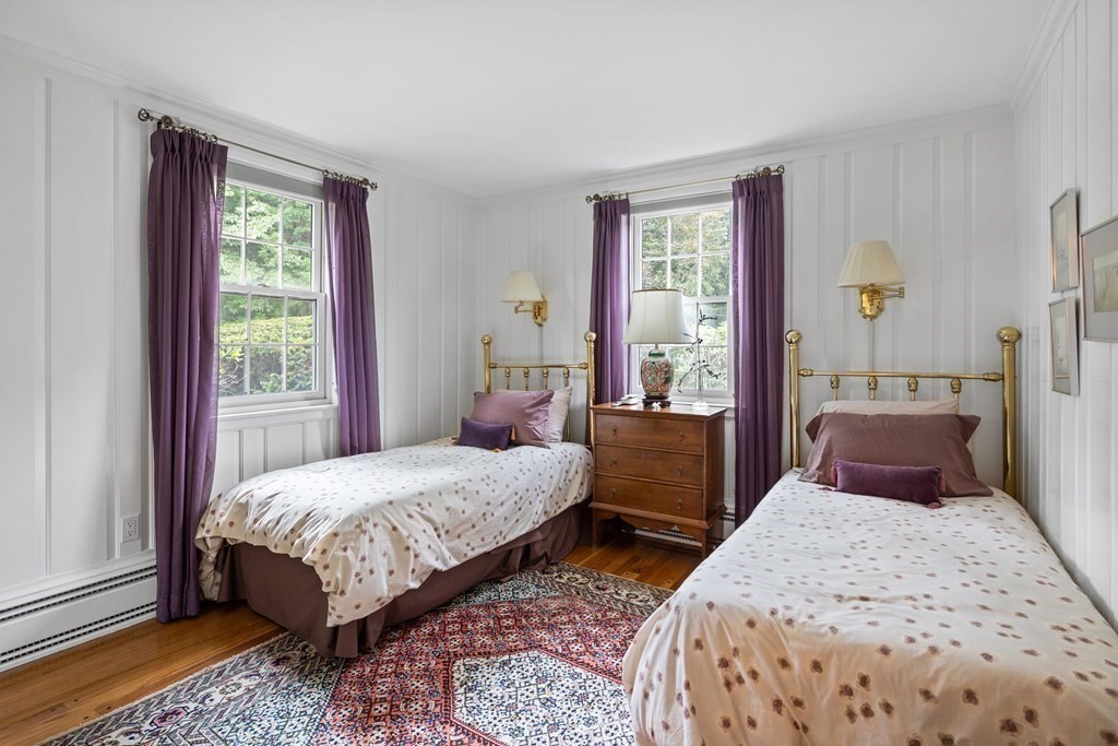 32 Hidden Road Andover, MA 01810 - Photo 24 of 34 a bedroom with a bed and wooden floor