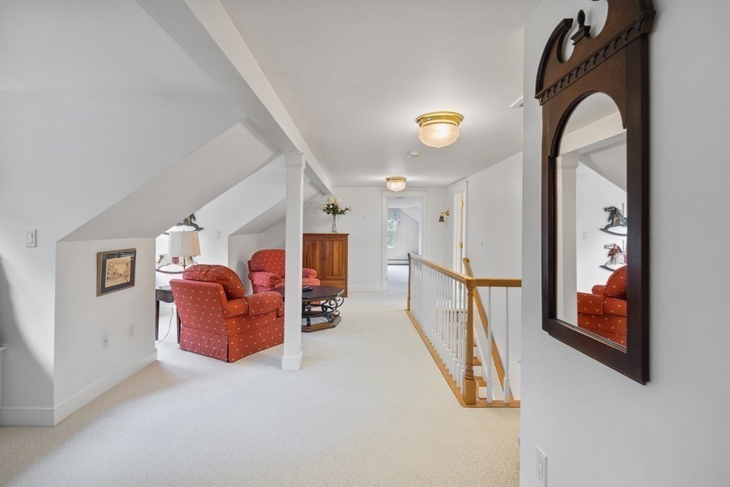 32 Hidden Road Andover, MA 01810 - Photo 29 of 34 a view of a livingroom with furniture and staircase