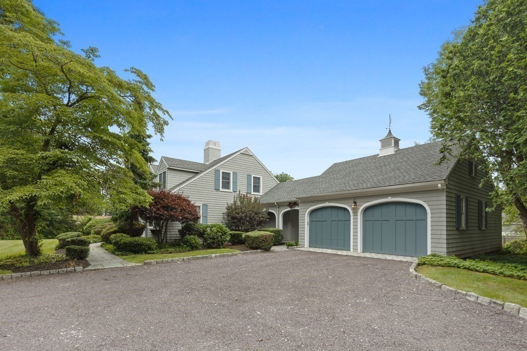 32 Hidden Road Andover, MA 01810 - Photo 4 of 34 a front view of a house with a yard and garage