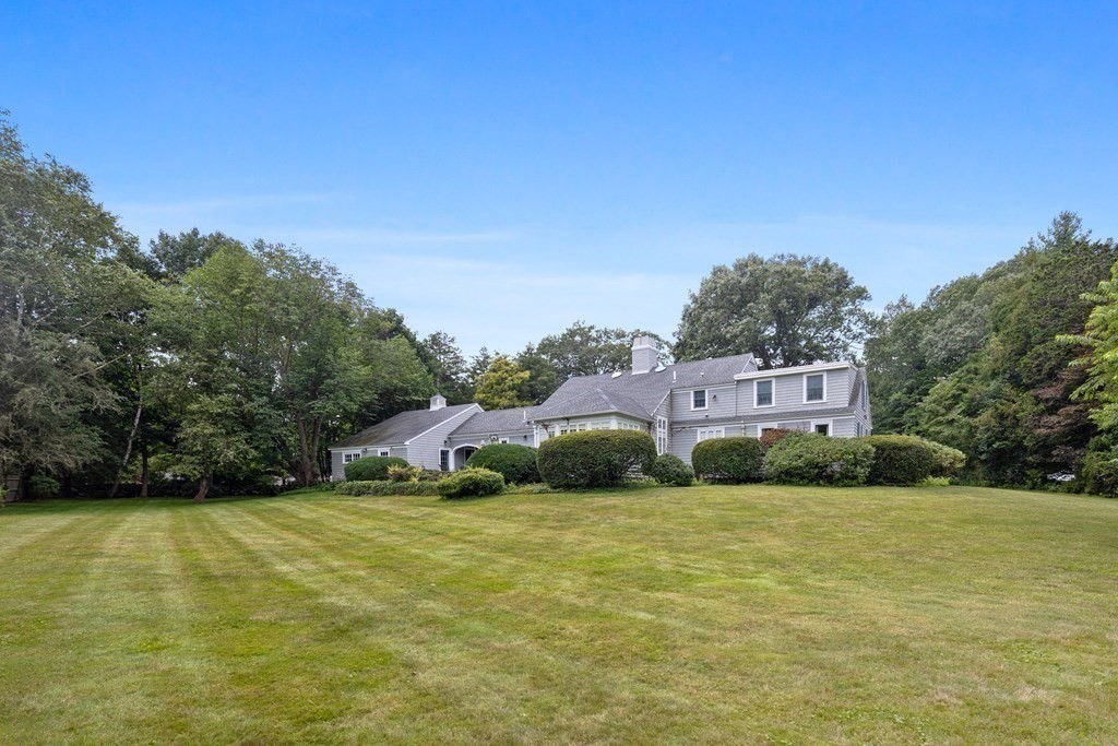 32 Hidden Road Andover, MA 01810 - Photo 9 of 34 a front view of a house with a yard
