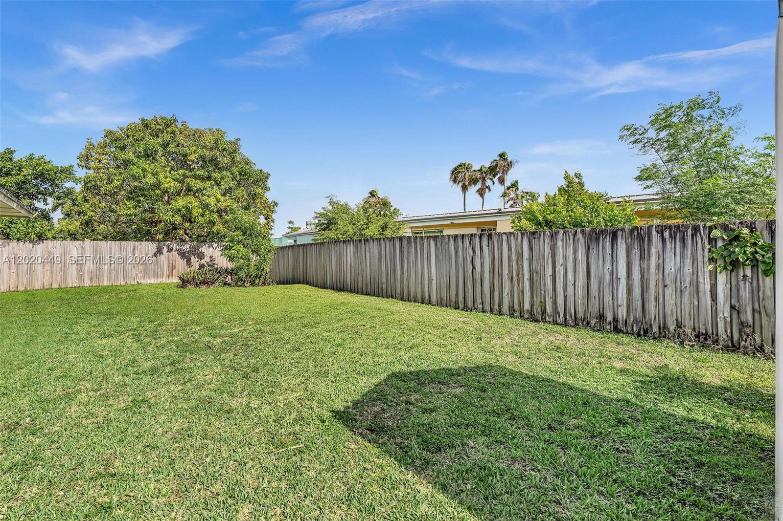 11061 Southwest 163rd Street Miami, FL 33157 - Photo 26 of 42 a view of a backyard with a garden