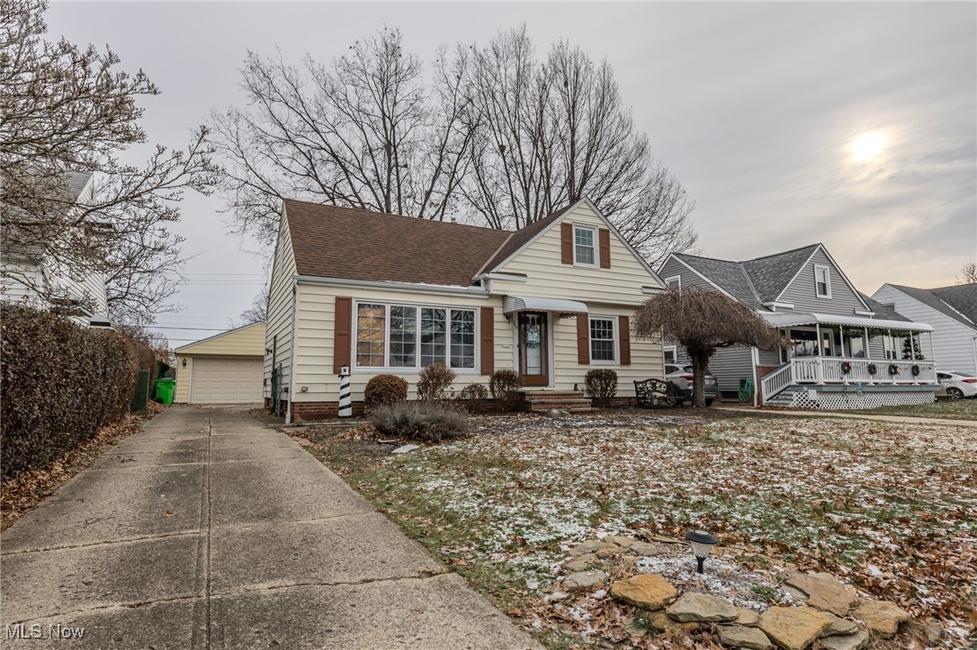 765 Pendley Road Willowick, OH 44095 - Photo 1 of 50 View of front of home featuring a garage and an outdoor structure