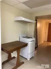 a kitchen with a stove and a table