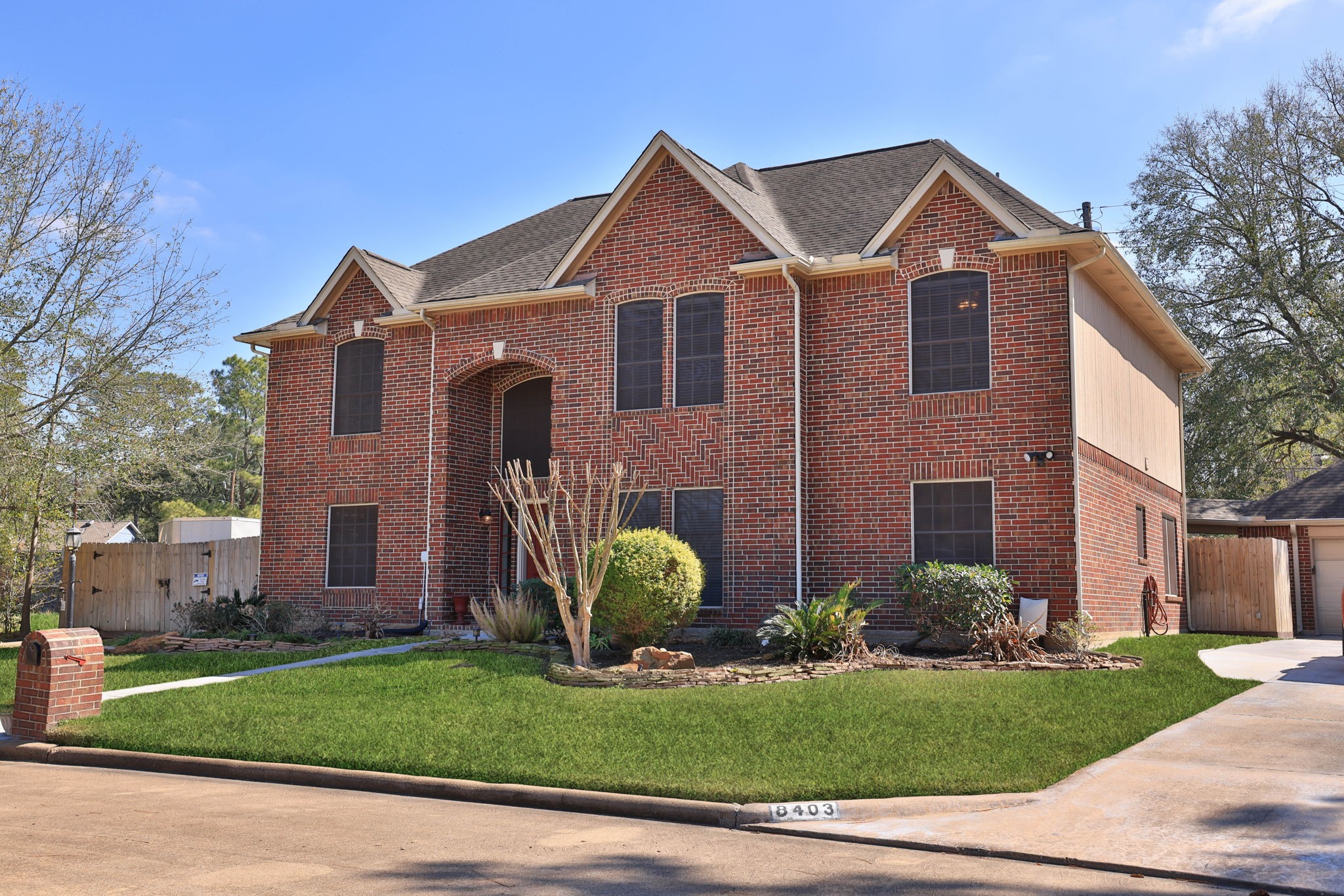 8403 Northbridge Drive Spring, TX 77379 - Photo 1 of 50 a front view of a house with garden