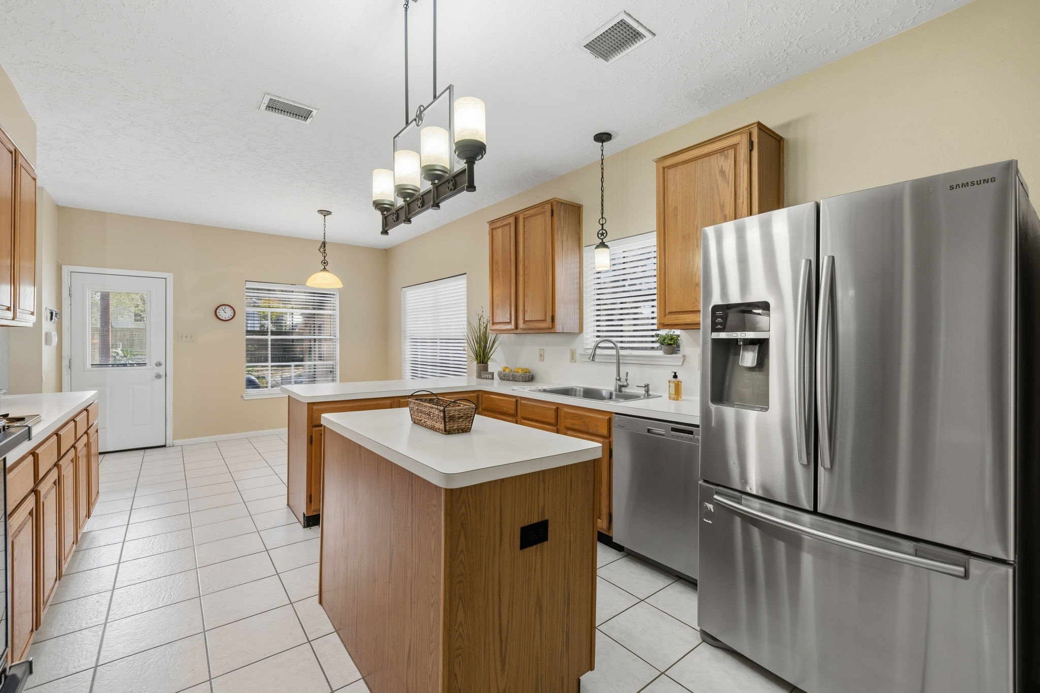 8403 Northbridge Drive Spring, TX 77379 - Photo 14 of 50 a kitchen with stainless steel appliances granite countertop a refrigerator a sink a stove and a refrigerator