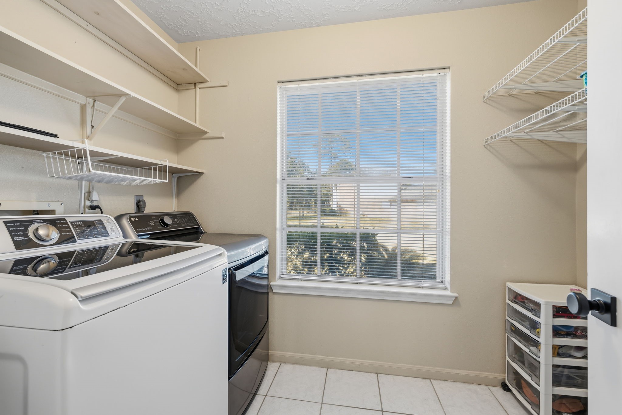 8403 Northbridge Drive Spring, TX 77379 - Photo 18 of 50 a kitchen with a stove and a cabinet