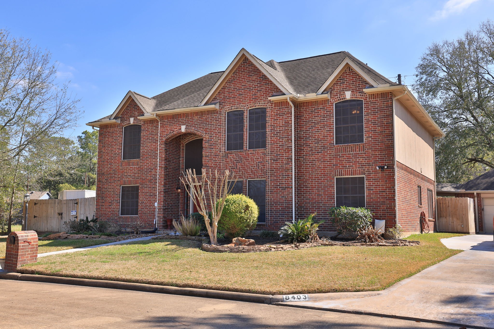 8403 Northbridge Drive Spring, TX 77379 - Photo 2 of 50 a front view of a house with garden
