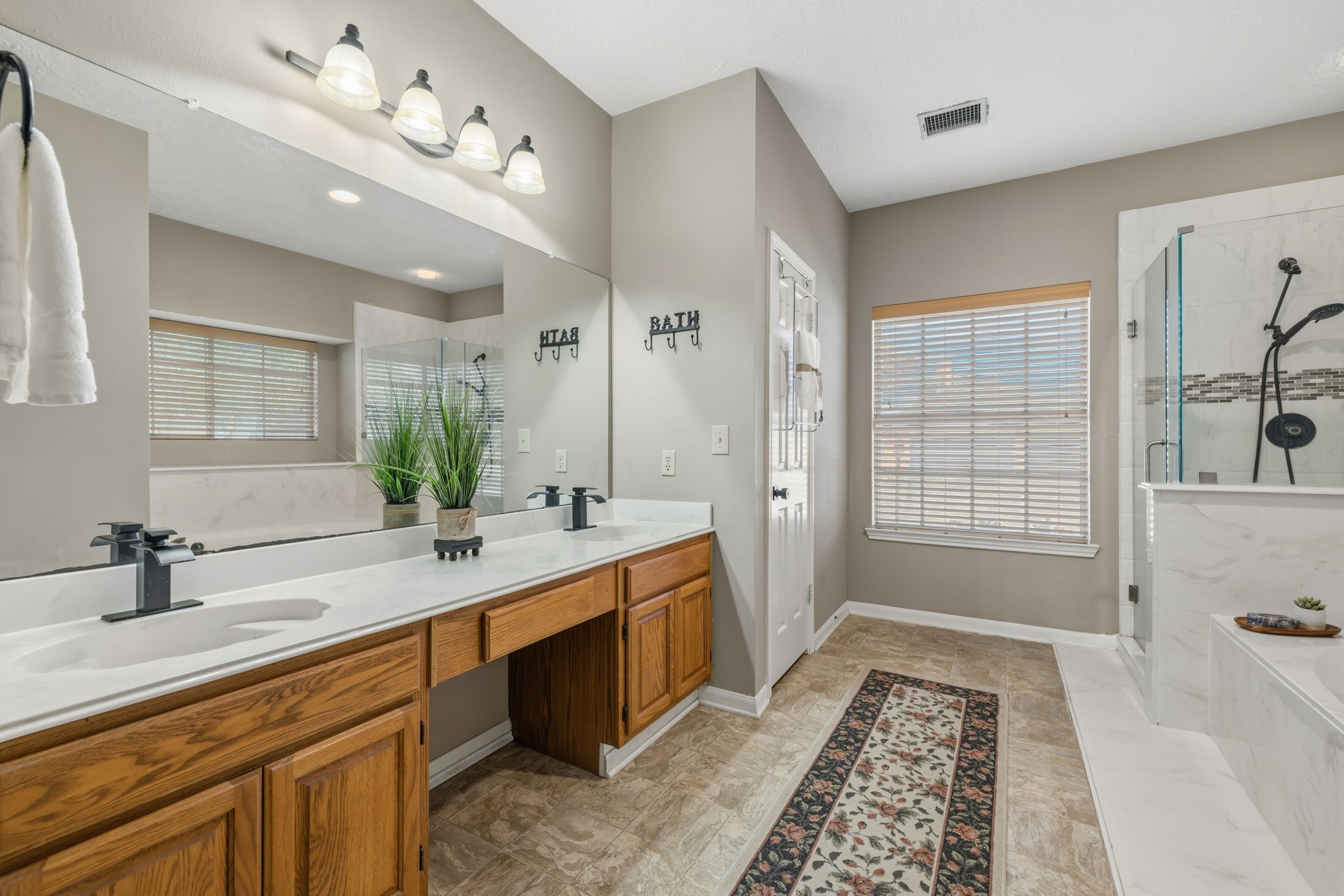 8403 Northbridge Drive Spring, TX 77379 - Photo 22 of 50 a spacious bathroom with a tub sink and mirror