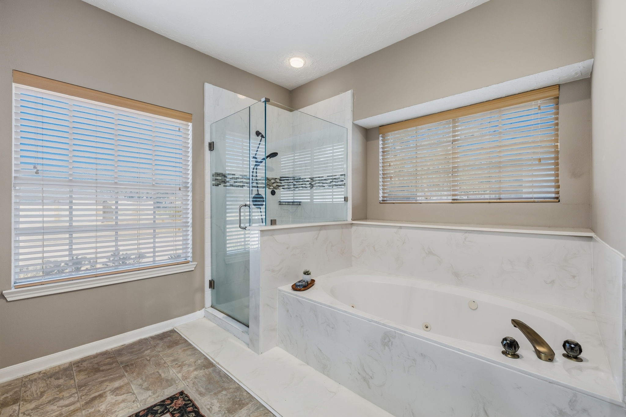 8403 Northbridge Drive Spring, TX 77379 - Photo 24 of 50 a bathroom with a bathtub and a window