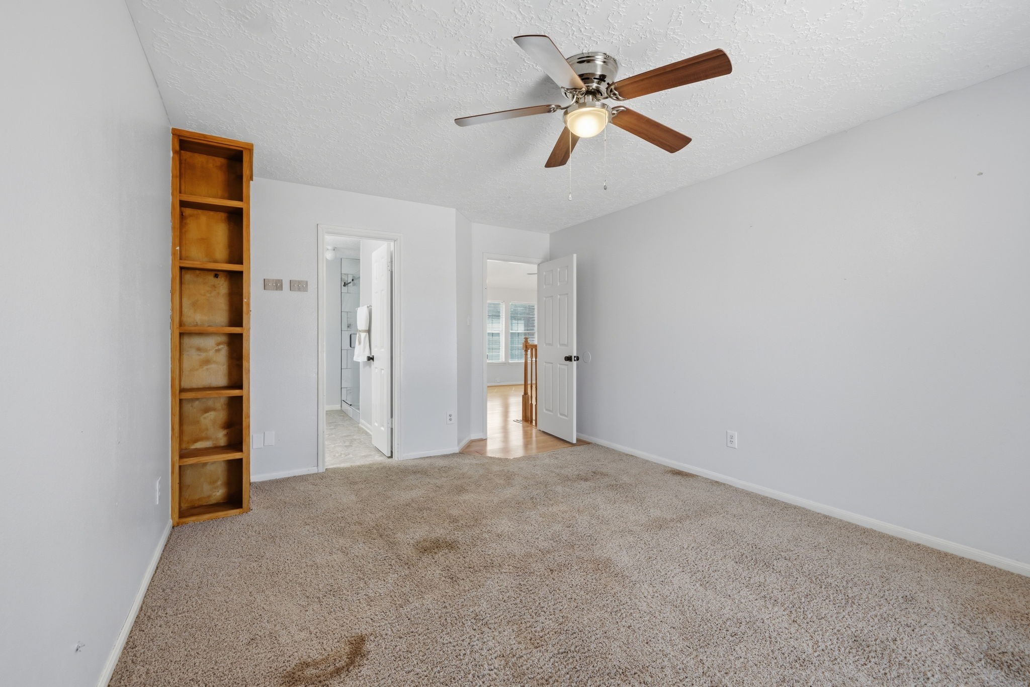 8403 Northbridge Drive Spring, TX 77379 - Photo 26 of 50 an empty room with closet and a ceiling fan