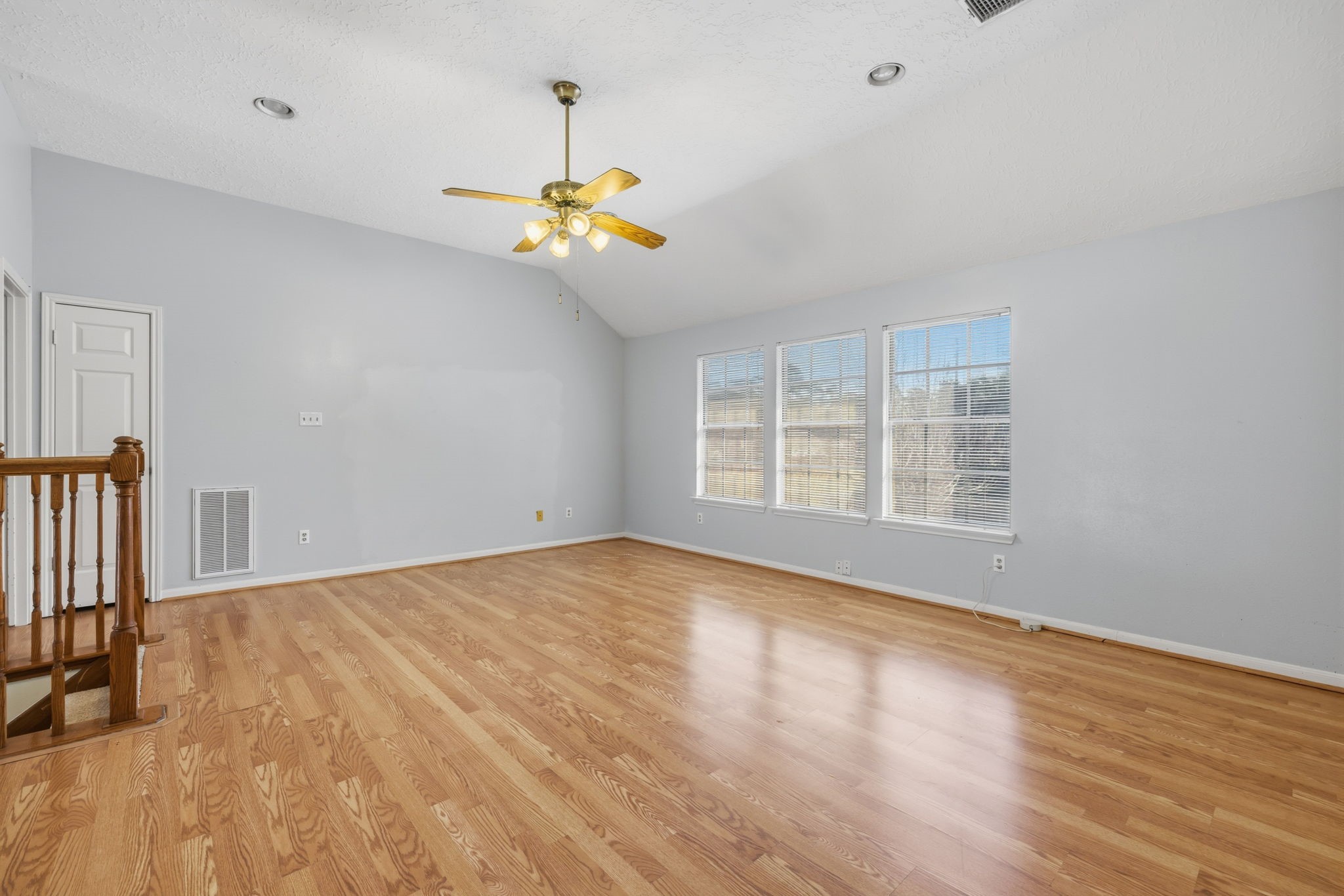 8403 Northbridge Drive Spring, TX 77379 - Photo 30 of 50 a view of an empty room with a window and wooden floor