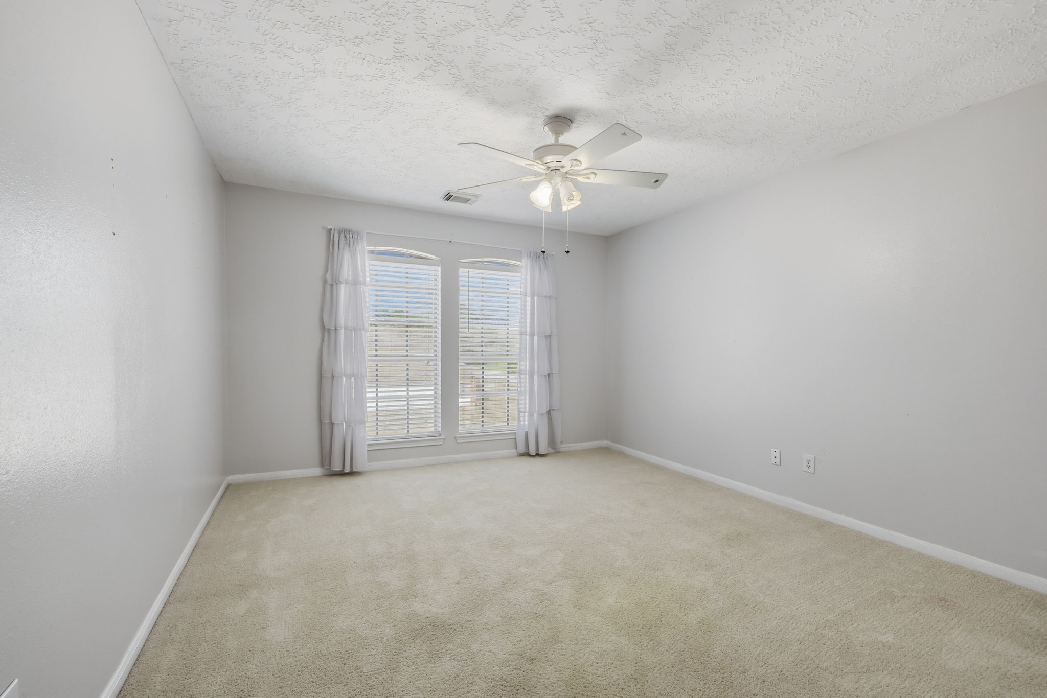 8403 Northbridge Drive Spring, TX 77379 - Photo 31 of 50 an empty room with chandelier fan