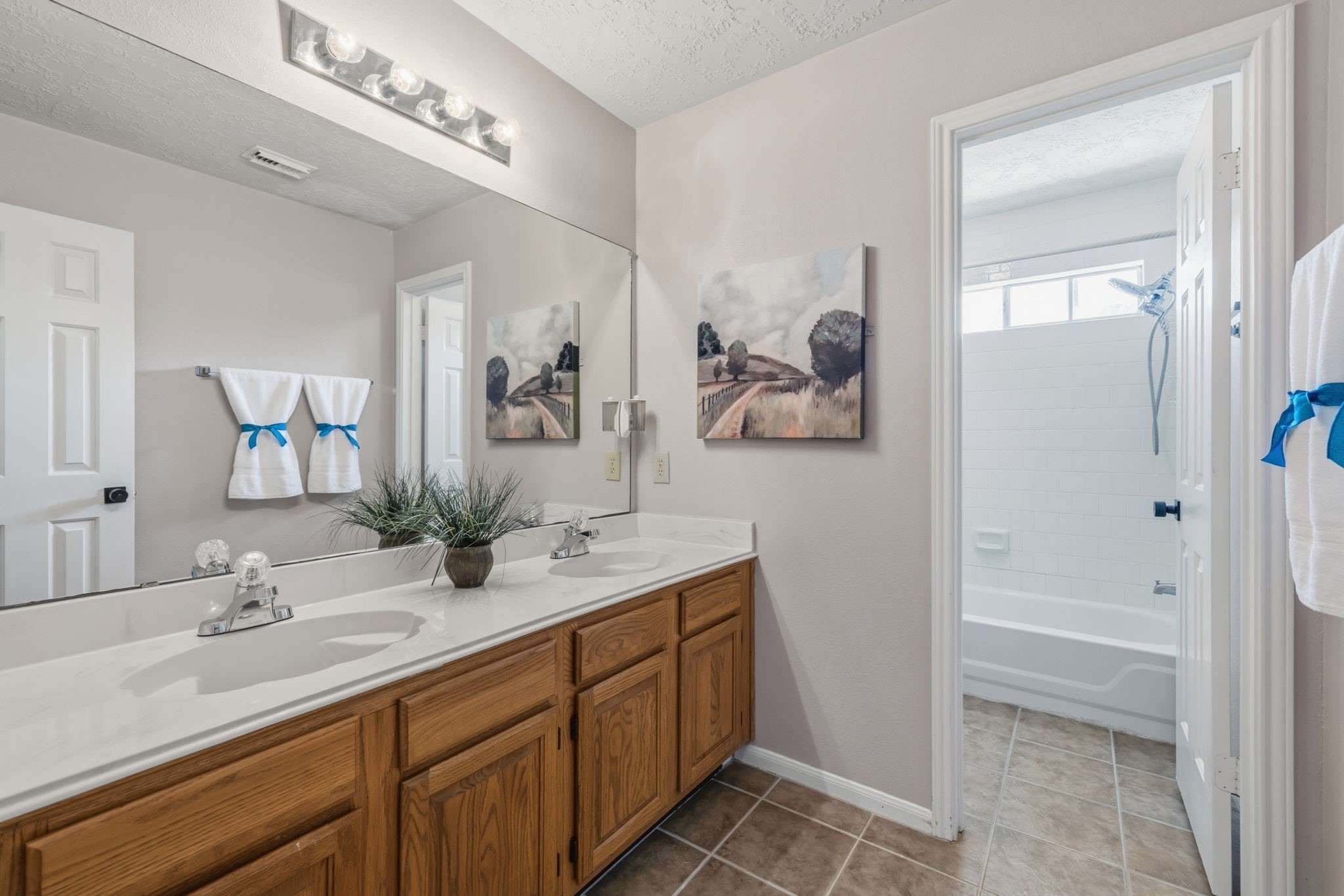 8403 Northbridge Drive Spring, TX 77379 - Photo 34 of 50 a bathroom with a granite countertop sink a mirror and a shower