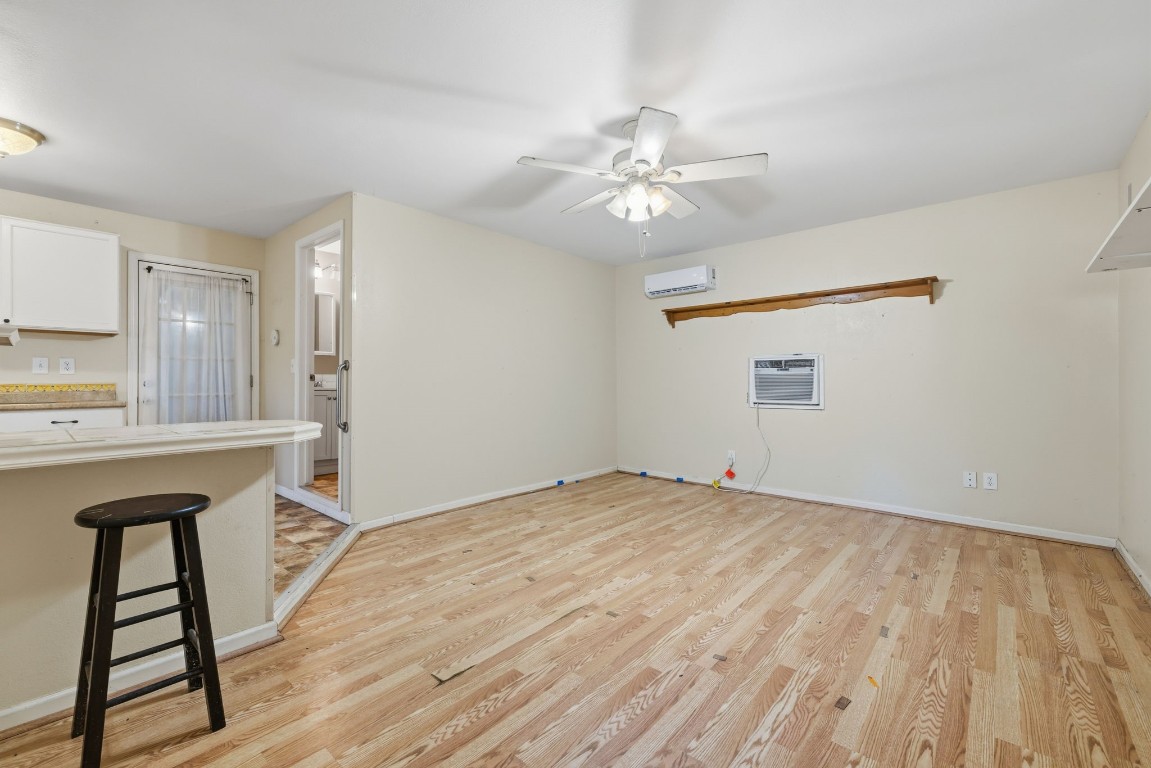 8403 Northbridge Drive Spring, TX 77379 - Photo 35 of 50 a view of an empty room with window and wooden floor