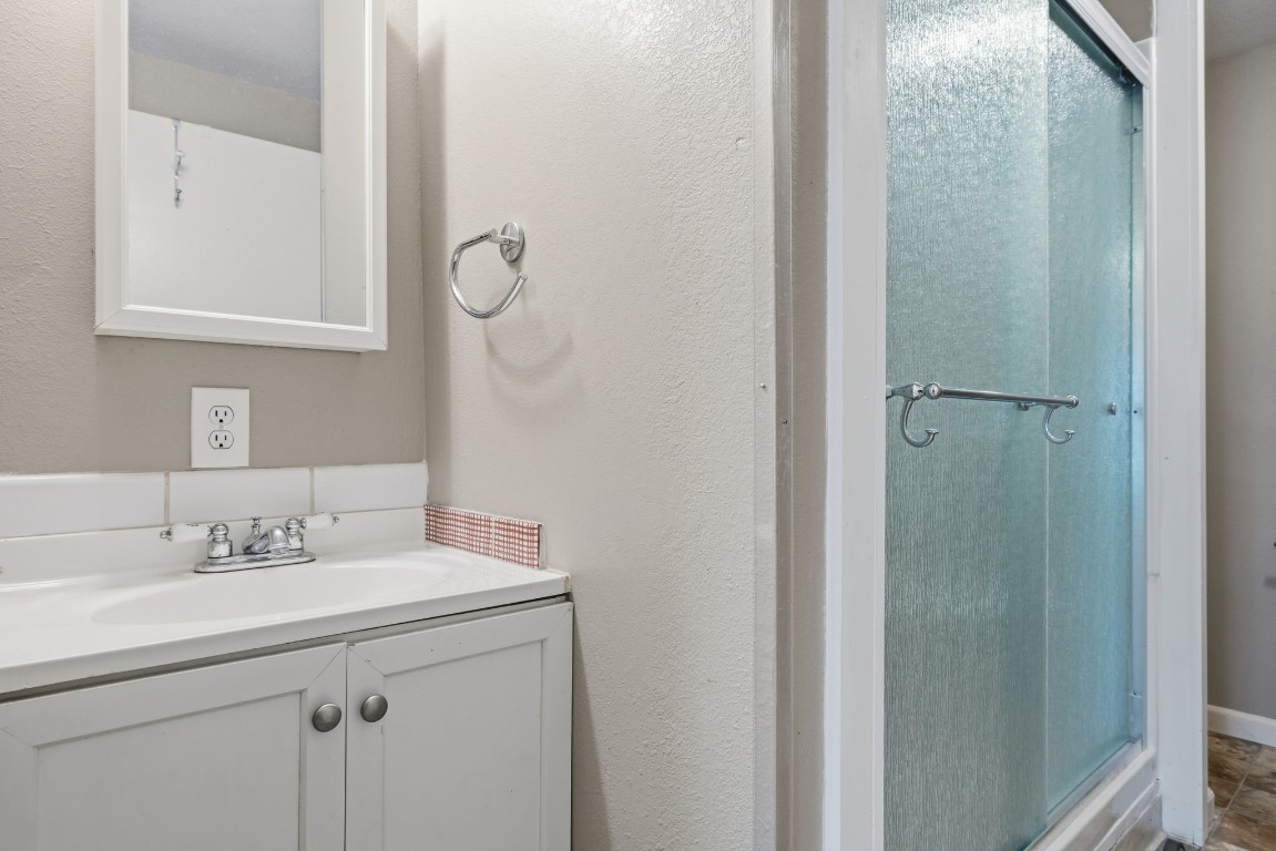 8403 Northbridge Drive Spring, TX 77379 - Photo 37 of 50 a bathroom with a sink mirror and vanity