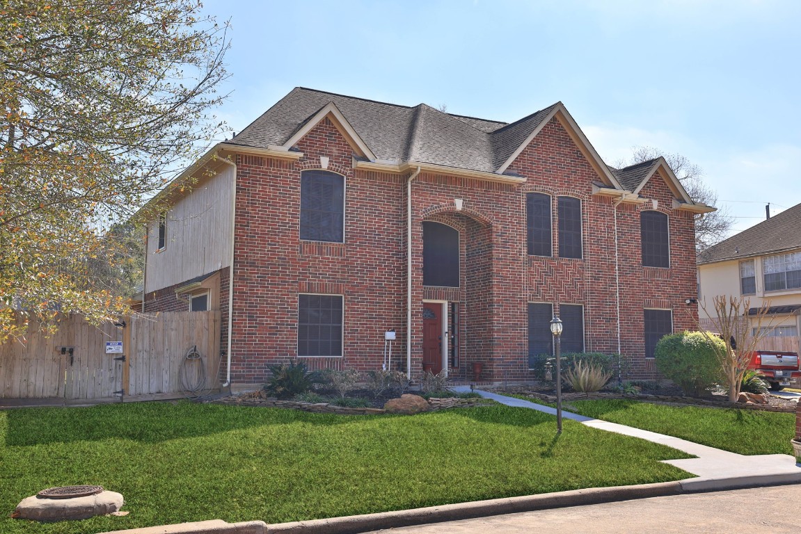 8403 Northbridge Drive Spring, TX 77379 - Photo 4 of 50 a front view of a house with a yard