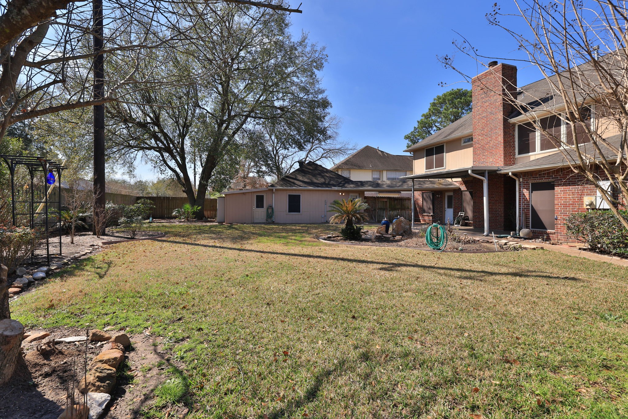 8403 Northbridge Drive Spring, TX 77379 - Photo 42 of 50 a view of a house with a yard and sitting area
