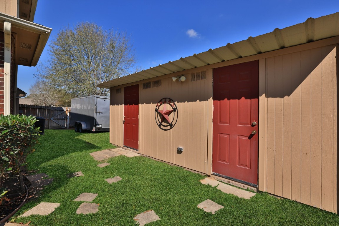 8403 Northbridge Drive Spring, TX 77379 - Photo 44 of 50 a backyard of a house with lots of green space
