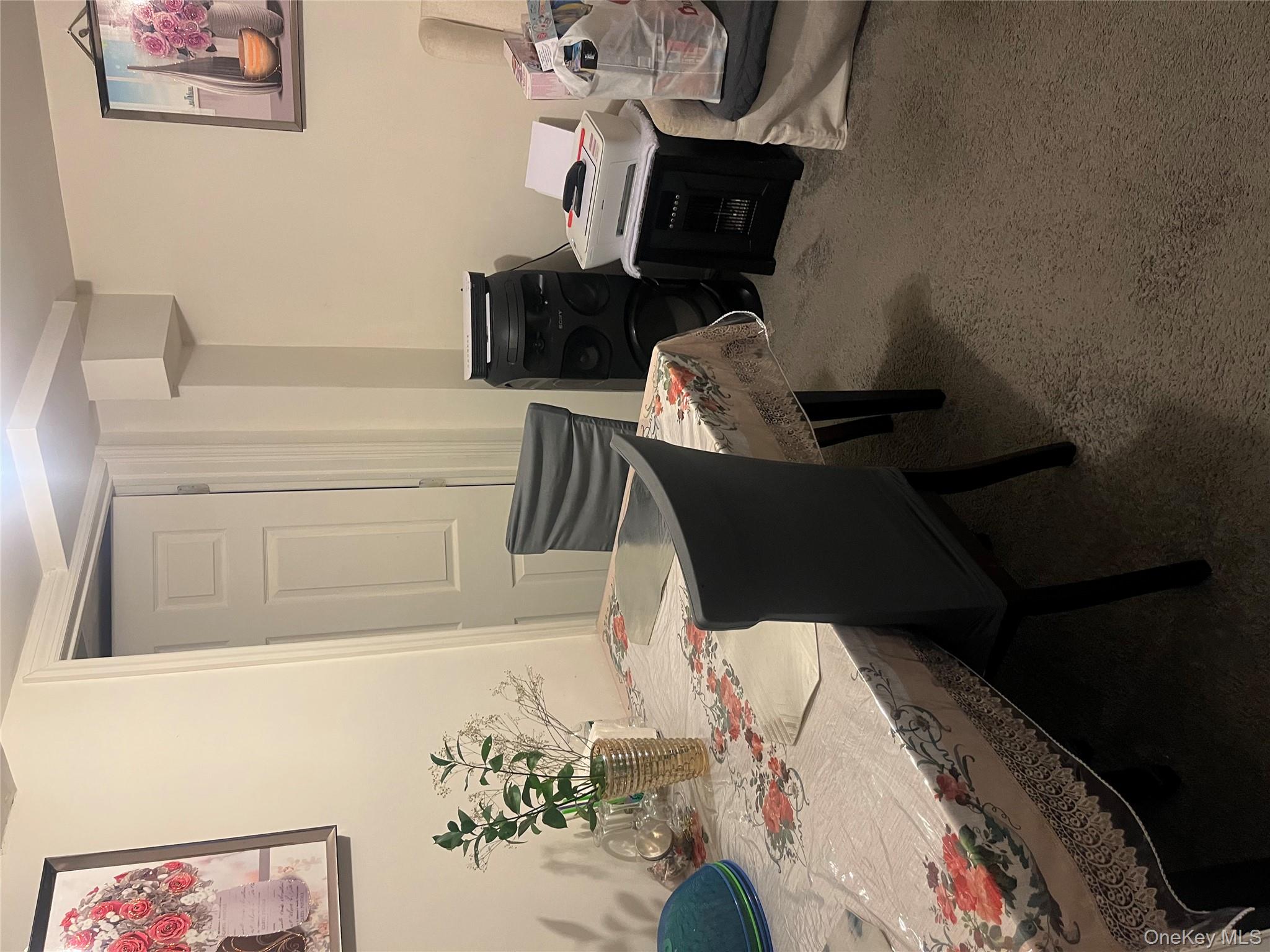 137-15 220th Place Queens, NY 11413 - Photo 26 of 28 a dining room with furniture and a wooden floor