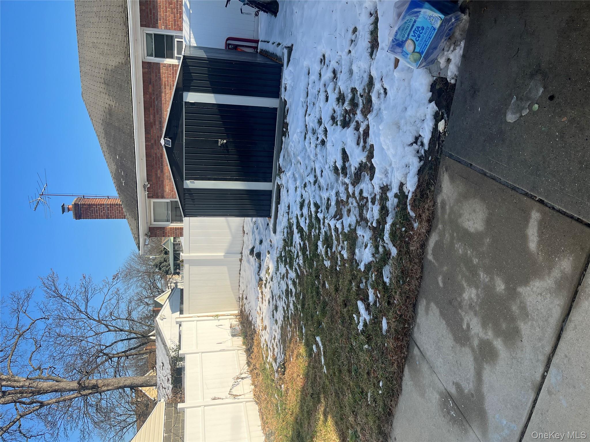 137-15 220th Place Queens, NY 11413 - Photo 3 of 28 a view of a house with a yard