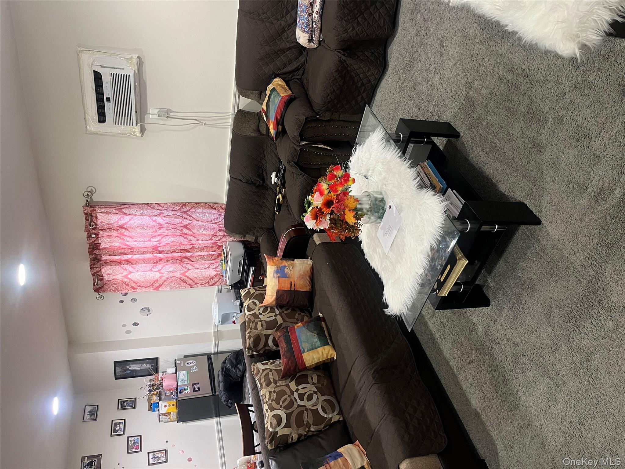 137-15 220th Place Queens, NY 11413 - Photo 4 of 28 a bedroom with furniture and a couch