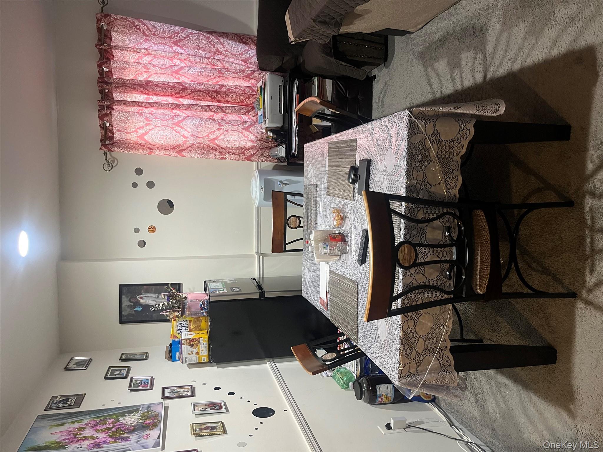 137-15 220th Place Queens, NY 11413 - Photo 5 of 28 a view of a dining room with furniture and window