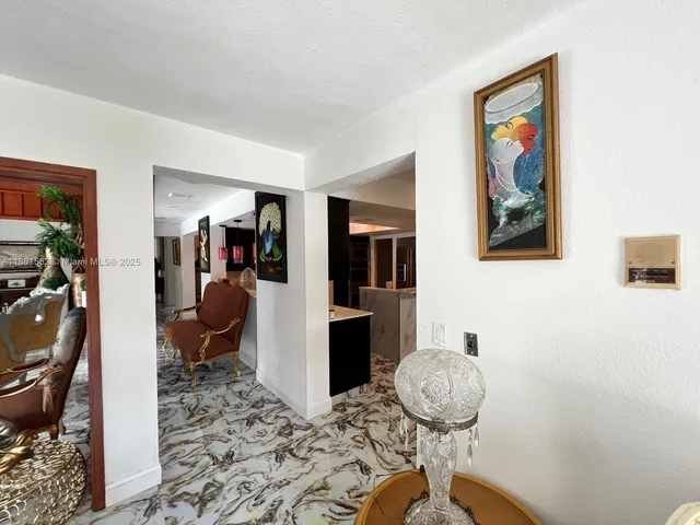 a kitchen with stainless steel appliances a stove a microwave and a sink