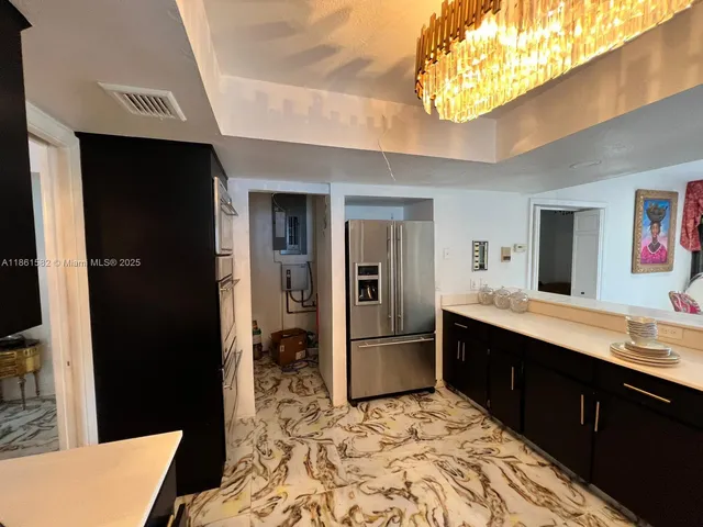 a living room with a table and a fireplace