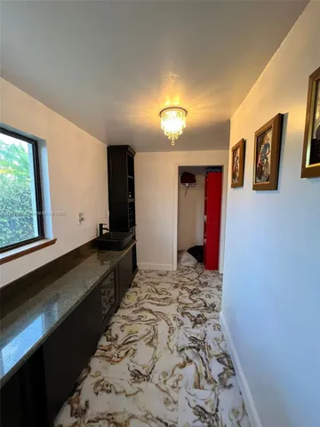 a kitchen that has a sink and a stove