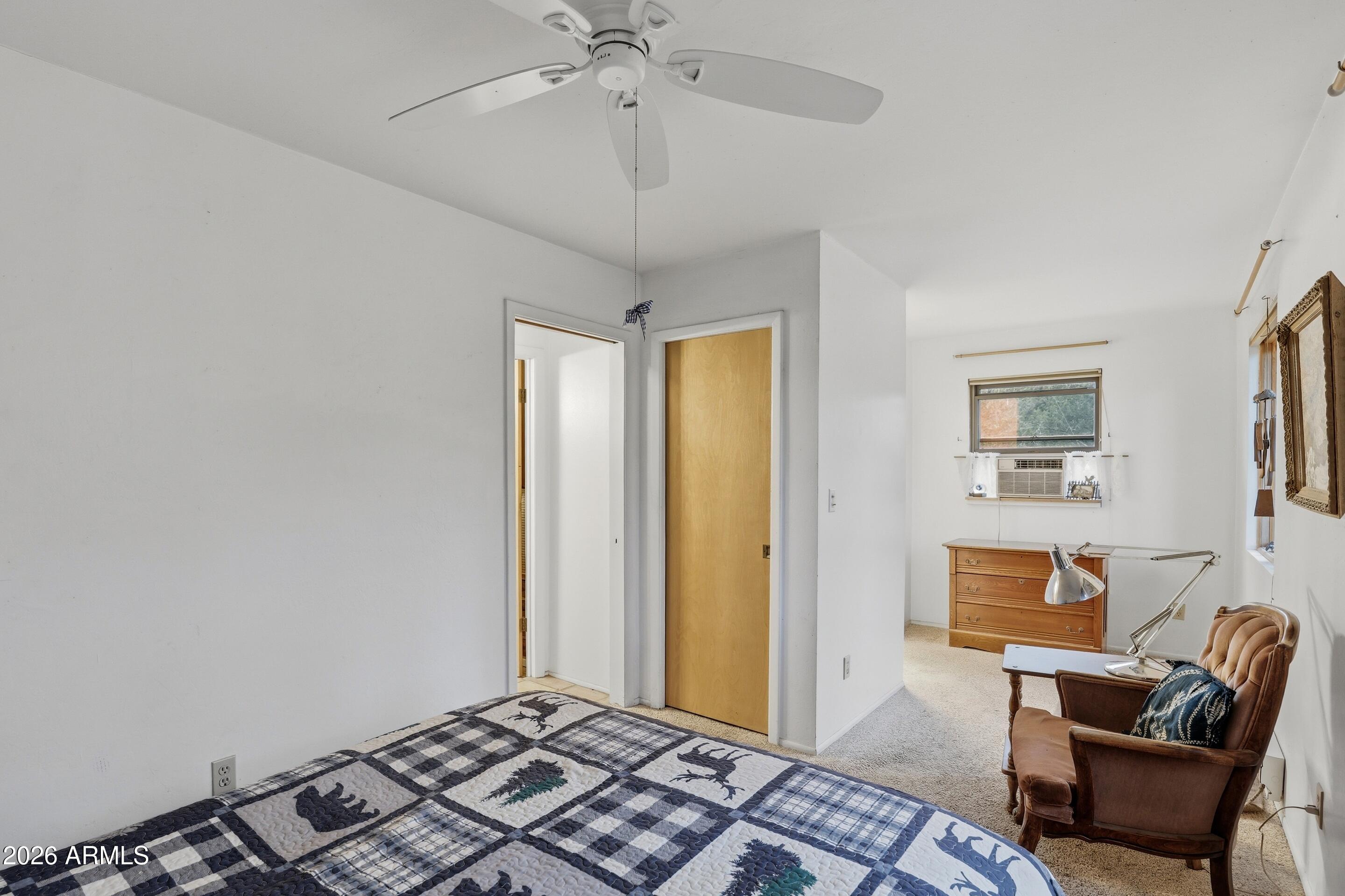 8135 West Gibson Ranch Road Payson, AZ 85541 - Photo 11 of 43 a bedroom with furniture and a window