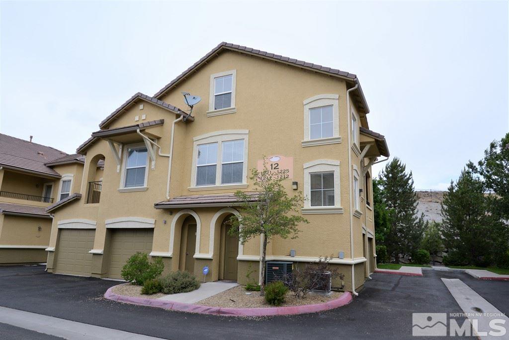 9050 Double R Boulevard, Unit 1221 Reno, NV 89521 - Photo 1 of 1 a front view of a house with a yard