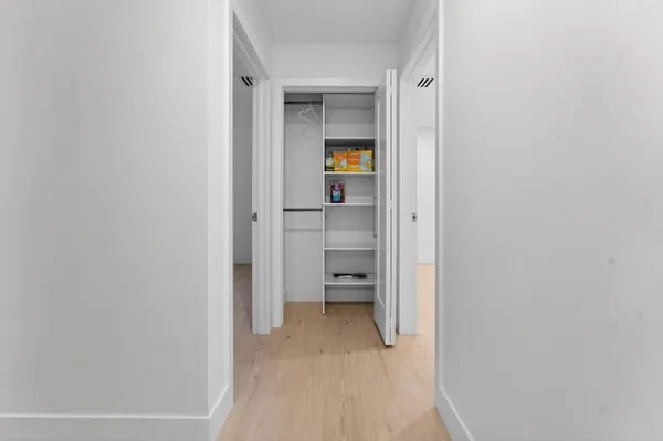 a view of a bedroom from a hallway