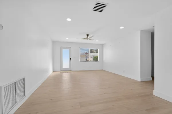 a view of an empty room with a window