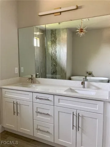 a bathroom with a sink and a mirror