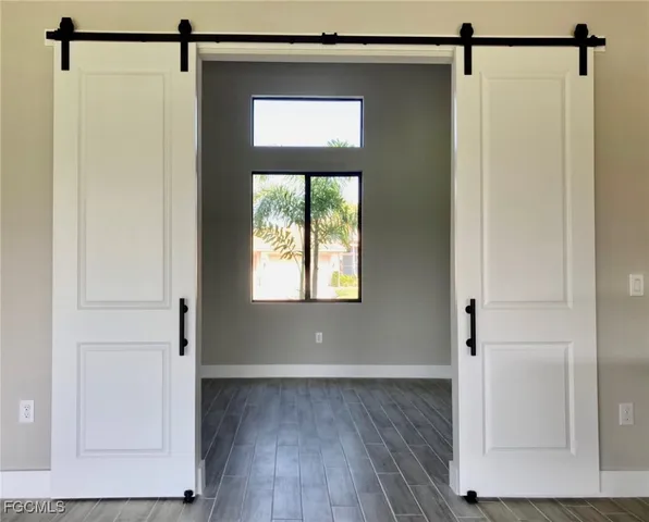 a view of front door with wooden floor