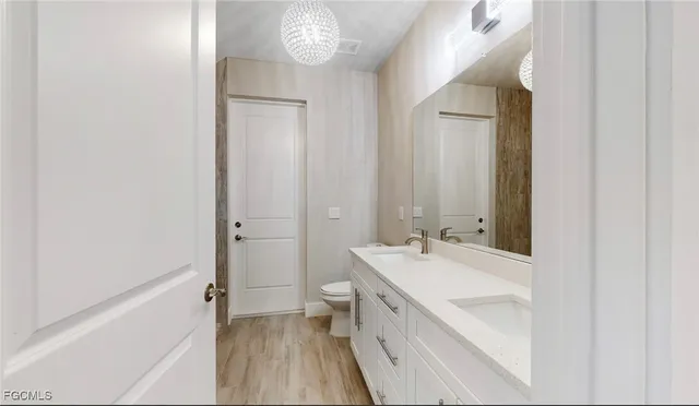 a living room with patio furniture and a garden