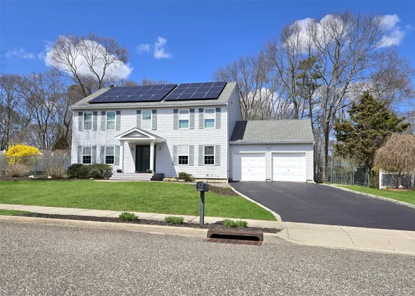 a view of a house with a yard porch and sitting area