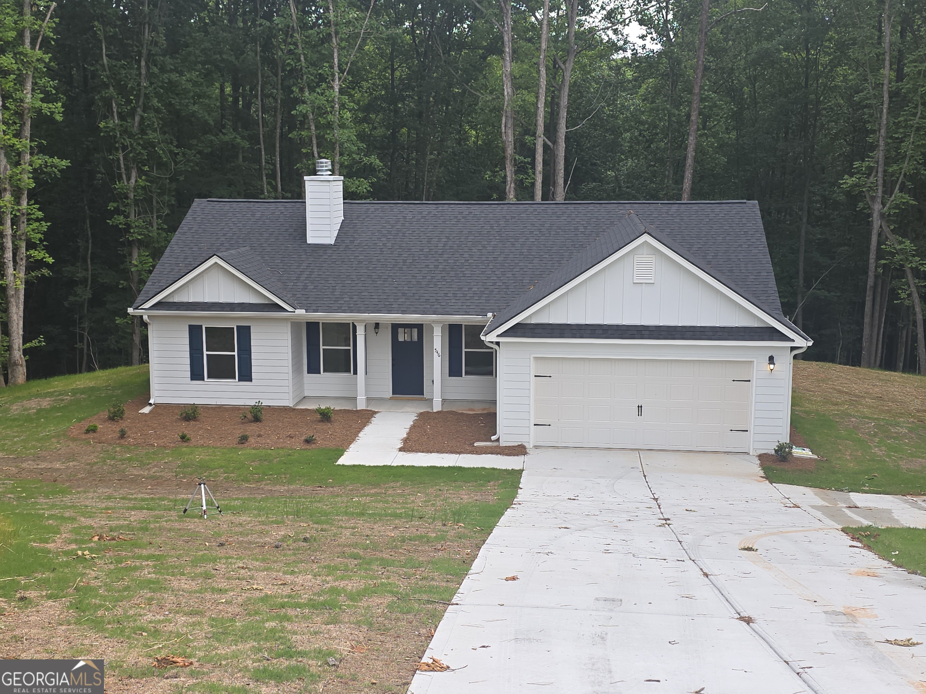 546 Hargrove Lake Road, Unit 2B Arnoldsville, GA 30619 - Photo 1 of 14 a view of a yard in front of a house with large trees