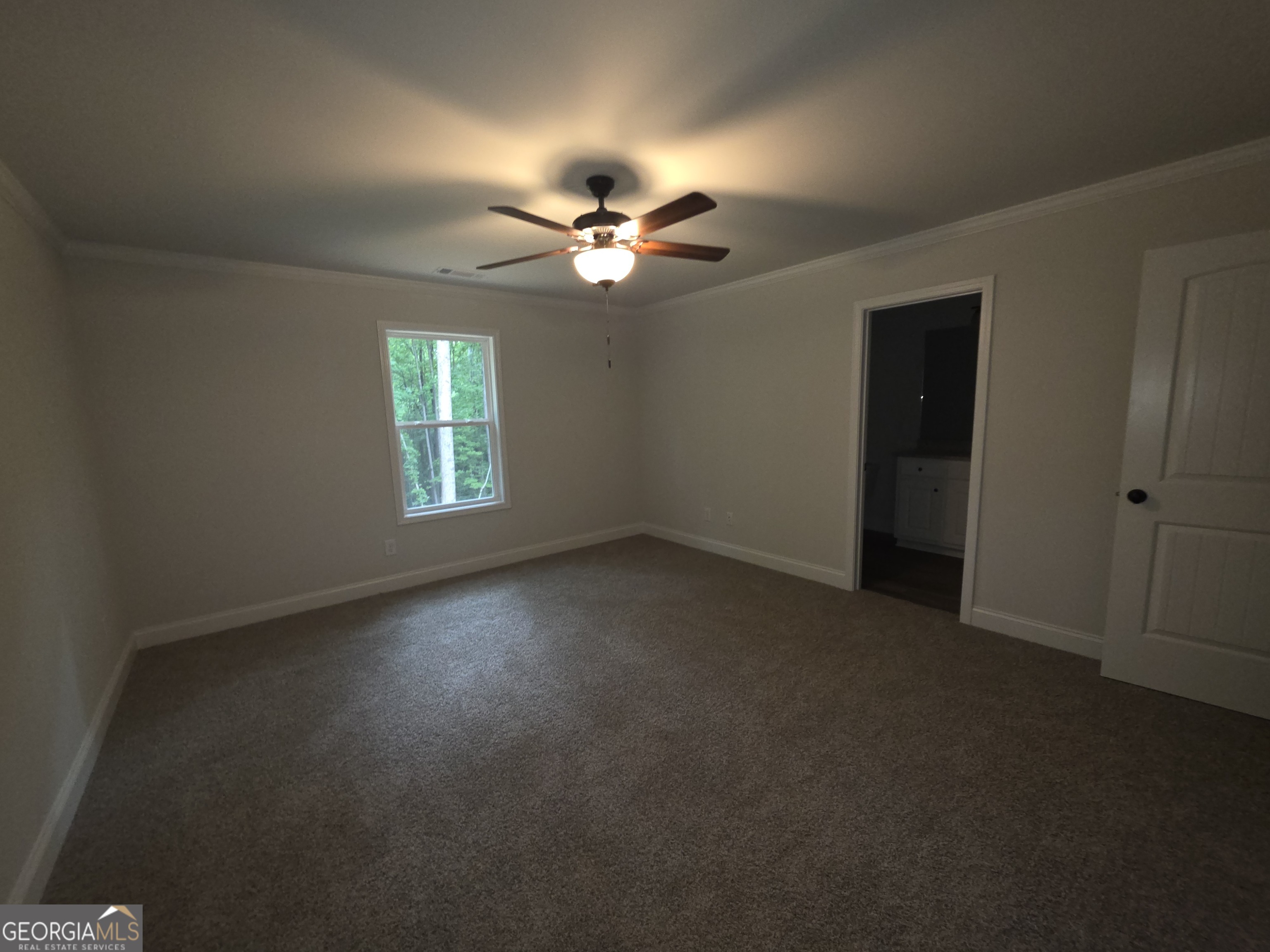 546 Hargrove Lake Road, Unit 2B Arnoldsville, GA 30619 - Photo 11 of 14 an empty room with windows and fan