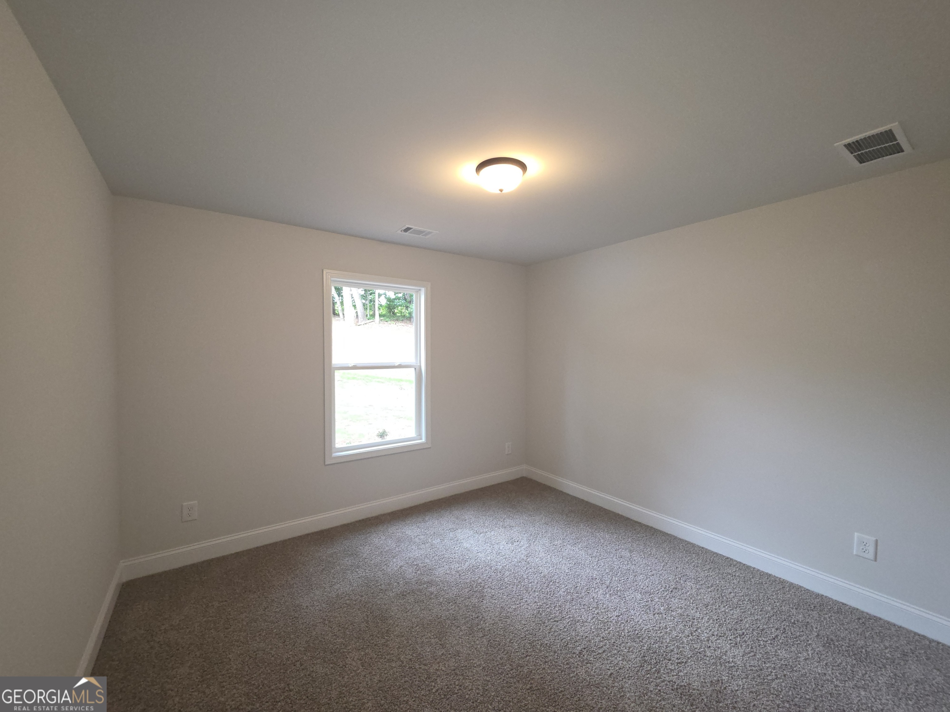 546 Hargrove Lake Road, Unit 2B Arnoldsville, GA 30619 - Photo 13 of 14 an empty room with a window