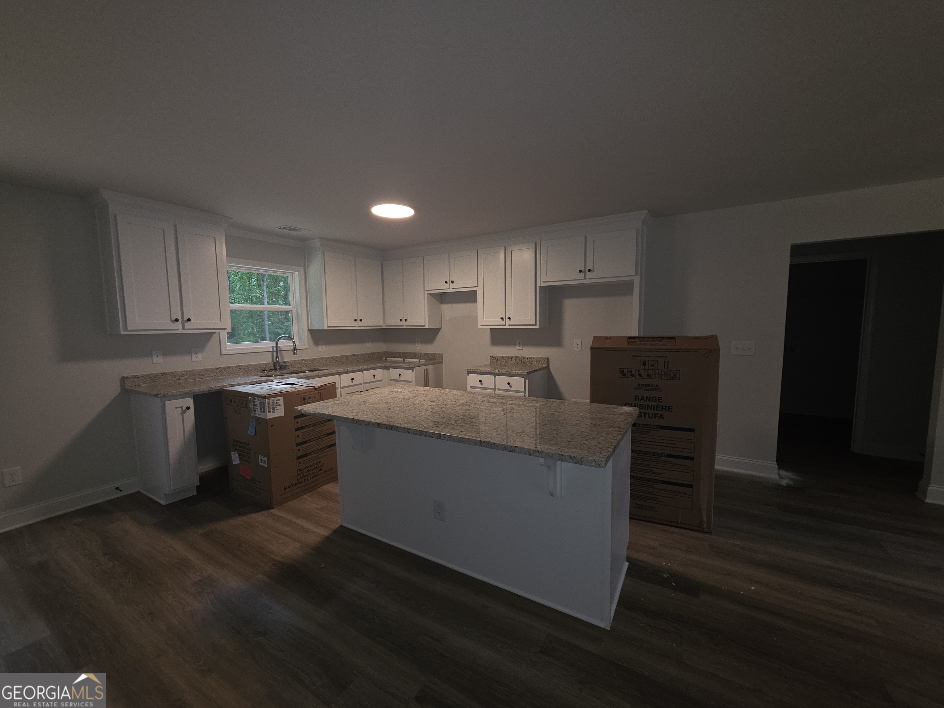 546 Hargrove Lake Road, Unit 2B Arnoldsville, GA 30619 - Photo 2 of 14 a kitchen with stainless steel appliances granite countertop a sink a stove a refrigerator a microwave oven and a cabinets with wooden floor