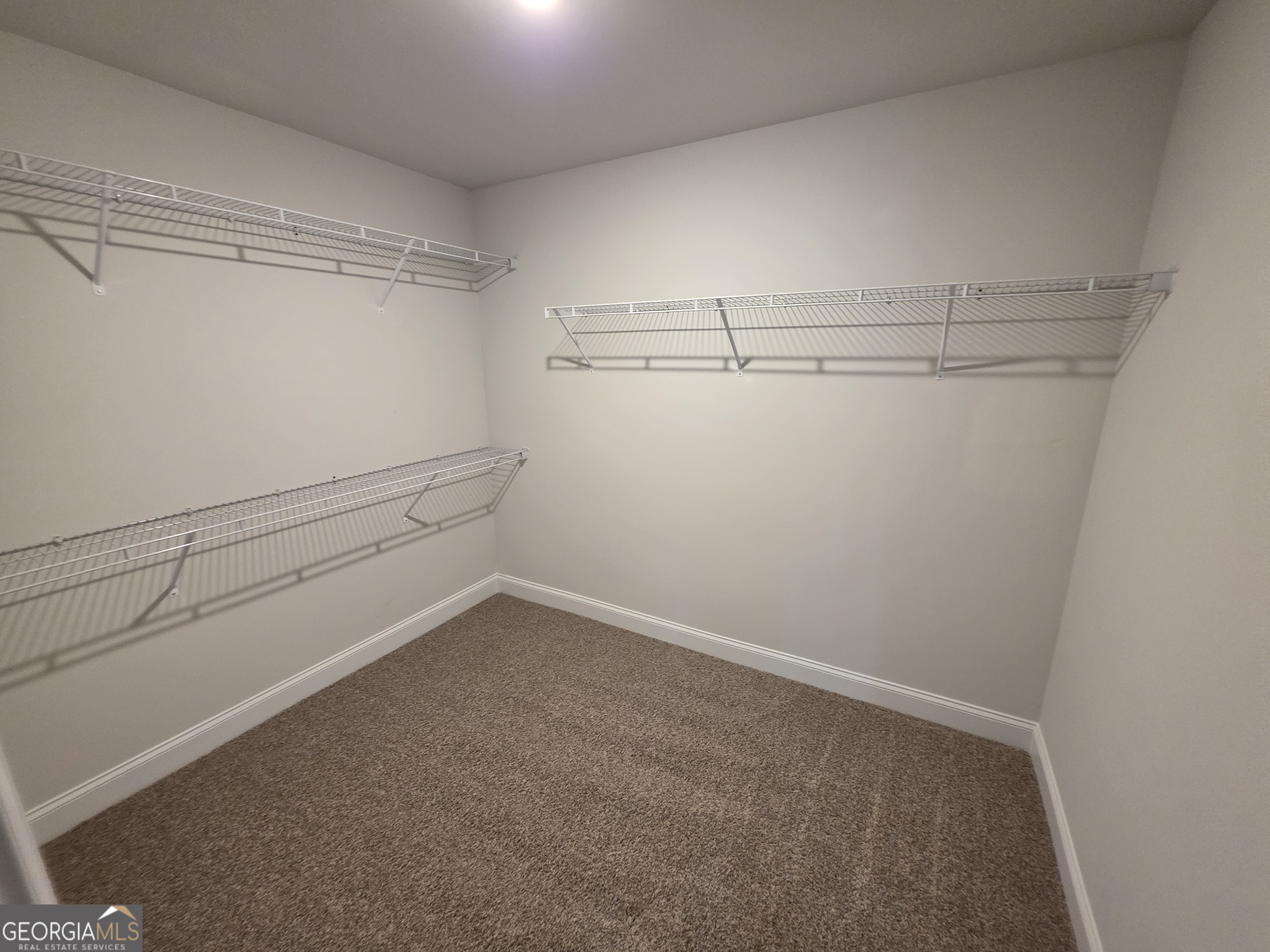 546 Hargrove Lake Road, Unit 2B Arnoldsville, GA 30619 - Photo 7 of 14 a view of storage and utility room with racks on the wall