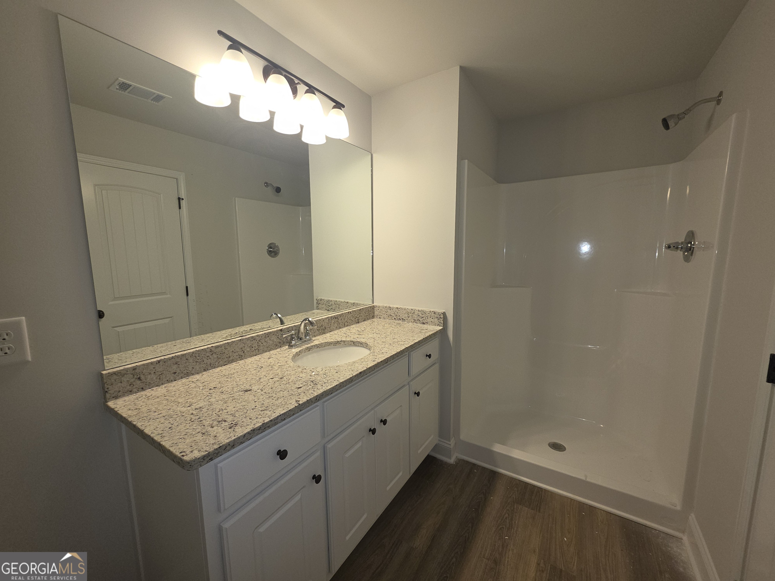 546 Hargrove Lake Road, Unit 2B Arnoldsville, GA 30619 - Photo 8 of 14 a bathroom with a granite countertop sink and a mirror
